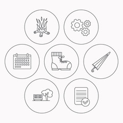 Bonfire, umbrella and hiking boots icons.