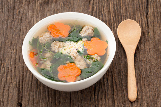  soup with pork and gourd on wooden background