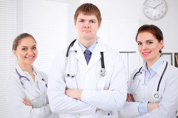 Happy doctor woman  with medical staff at the hospital