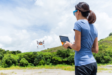 Woman playing with drone