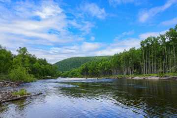 Fototapeta na wymiar Mountain River . Mountain River in the northeast of Khabarovsk Krai , Russia .
