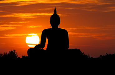 Silhouette public big white Buddha, sunset in Thailand