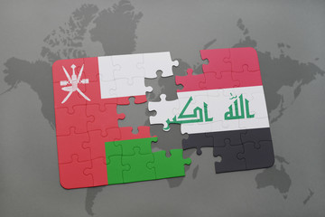 puzzle with the national flag of oman and iraq on a world map background.