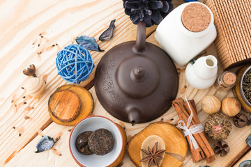 dry tea leaves cinnamon and on wooden background
