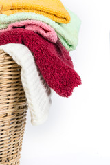 close up color mix  towel in wicker baskets on white background