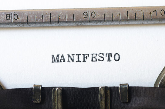 word manifesto typed on typewriter