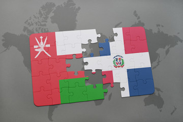 puzzle with the national flag of oman and dominican republic on a world map background.