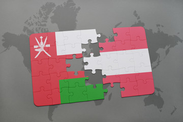 puzzle with the national flag of oman and austria on a world map background.