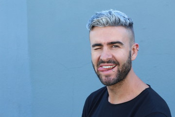 Peculiar guy making a funny face 