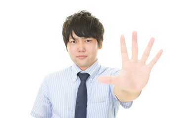 ストップのジェスチャーをする男性