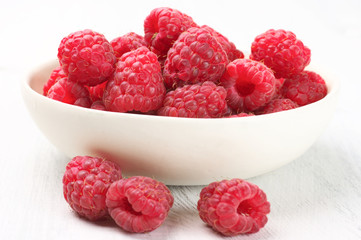Raspberries in white bowl