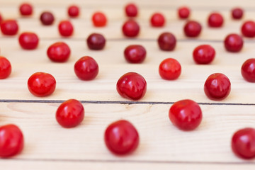 Naklejka na ściany i meble Fresh cherries on a wooden background