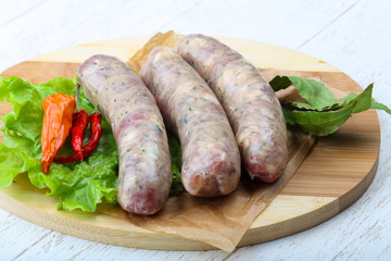 Raw sausages for cooking