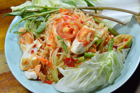 papaya salad with salt egg on dish