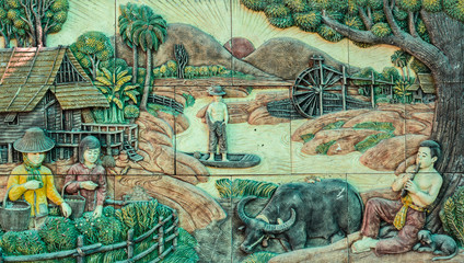 Thai stucco art of traditional Thai rural culture life in the past