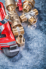 Set of plumbing hardware on metallic background construction con