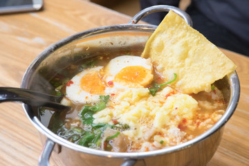 Thai style noodle, Mama soup Tom Yum Kung topped with egg