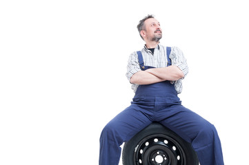 Handsome mechanic man standing with folded arms