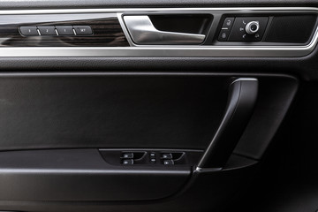 Obraz premium Inner door handle, modern car interior detail