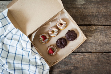 Colorful donuts in box