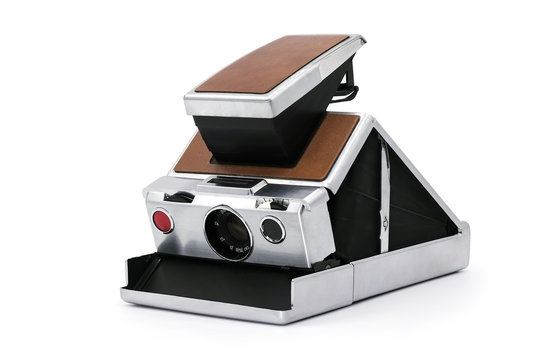 Old Instant Camera On White Background, Being Opened