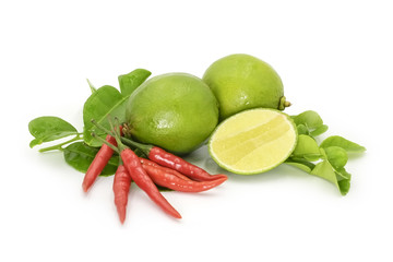 Kaffir leaves, limes and red Thai chilli on white backround.