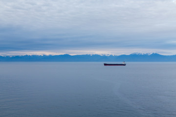 Fototapeta na wymiar Freighter in Alaskan Dawn