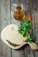 Green tea and mint on cutting board