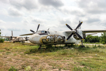 Older aircraft flying in an abandoned airport