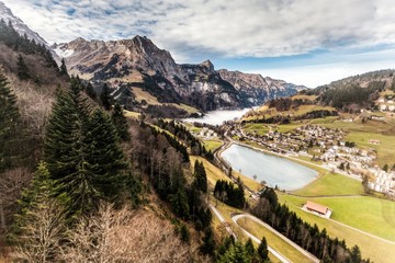 Holiday in Switzerland - Beautiful foggy view of winter landscape towards Engelberg, Switzerland