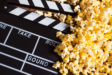 Movie clapper board and pop corn