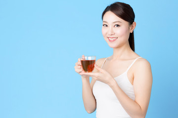 attractive asian woman isolated on blue background