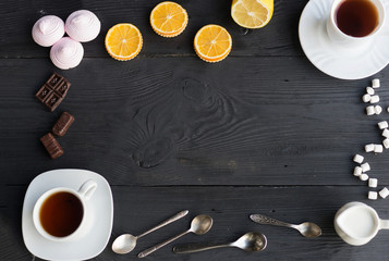 Obraz na płótnie Canvas An assortment tea, coffee, marshmallow, chocolate and orange.