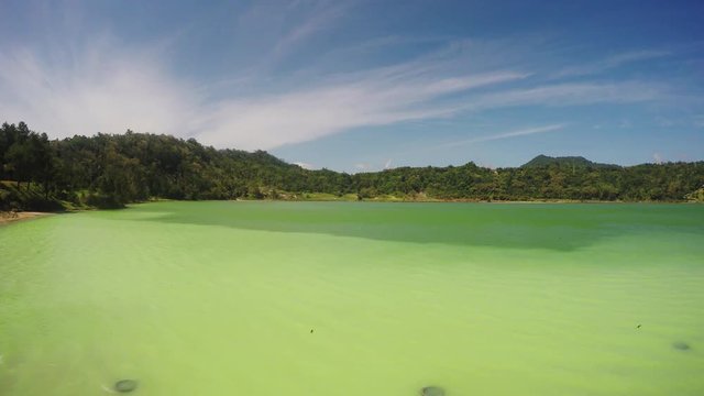 panorama of famous tourist attraction natural sulphurous lake - Danau Linow, North Sulawesi Indonesia with green toxic water