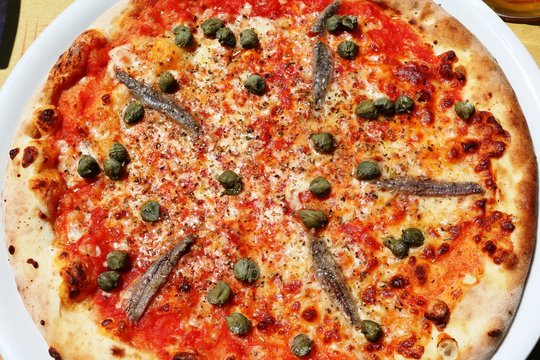 Italian pizza with capers and anchovies
