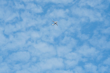 The plane in the blue sky