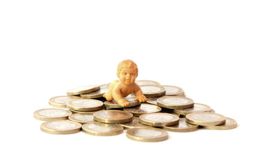 A baby on a pile of money