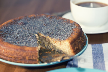 A lemon cake served with a cup of coffee, Shallow dof