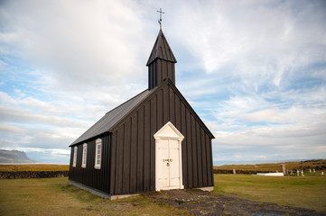 Fototapeta premium Typical Icelandic black wooden church in Budir, Iceland.