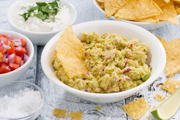 spicy avocado sauce and assorted sauces with corn chips 