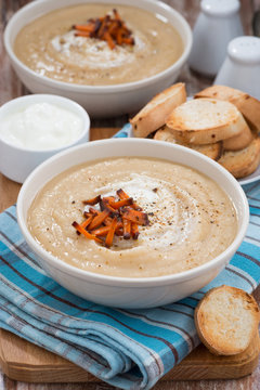 vegetable cream soup with caramelized carrots, vertical