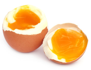 Broken eggs over white background