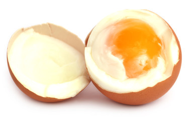 Broken eggs over white background