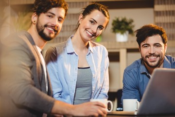 Colleagues using laptop