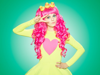 Fototapeta na wymiar Girl doll with pink hair