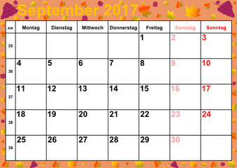 Kalender 2017 Monat September mit Feiertagen für Deutschland auf buntem Hintergrund mit herbstlichen Motiven und roten Weintrauben