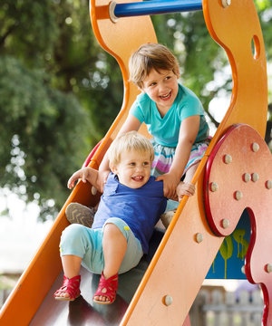  Laughing Children On Slide