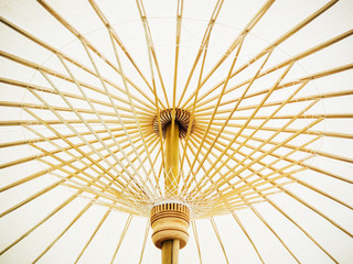 Obraz premium Thai Orient paper umbrella with bamboo stalks