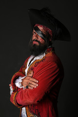 Portrait of handsome man in a pirate costume