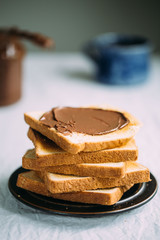 Slices of bread with chocolate cream. Close up.